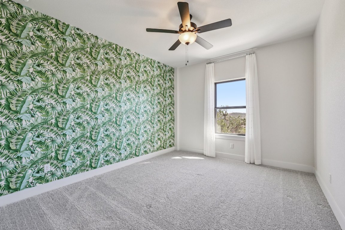 19316 Splendor Court Jonestown, TX 78645 - Photo 34 of 40 wooden floor in an empty room with a window
