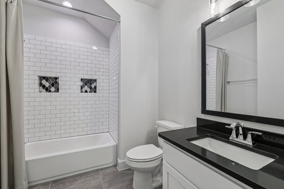 19316 Splendor Court Jonestown, TX 78645 - Photo 35 of 40 a bathroom with a sink a toilet and shower