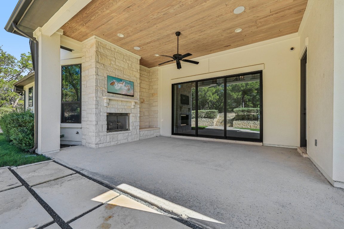 19316 Splendor Court Jonestown, TX 78645 - Photo 37 of 40 a view of a building with a ceiling fan and windows
