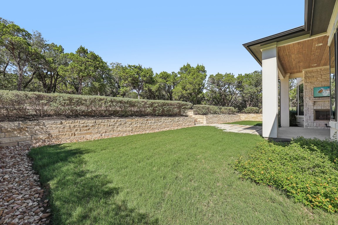 19316 Splendor Court Jonestown, TX 78645 - Photo 38 of 40 a view of a backyard with large trees
