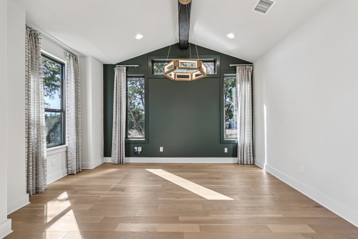 19316 Splendor Court Jonestown, TX 78645 - Photo 5 of 40 a view of a hallway with wooden floor