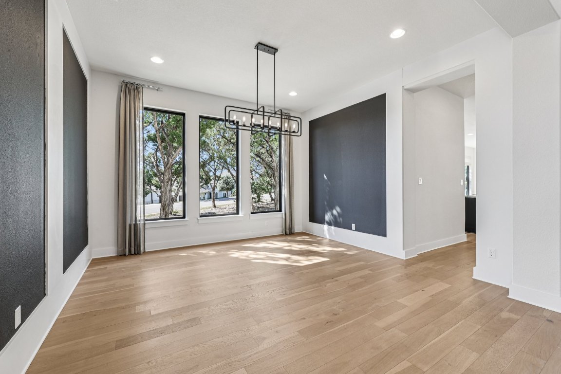 19316 Splendor Court Jonestown, TX 78645 - Photo 7 of 40 a view of an empty room with a window and chandelier