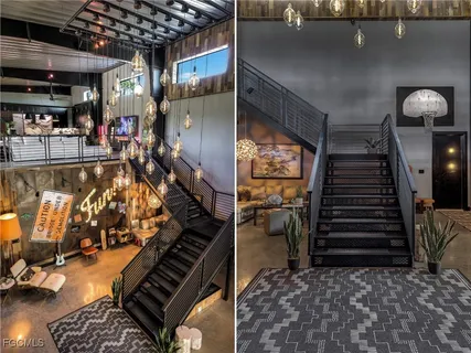 a living room with furniture and a floor to ceiling window