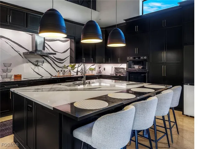 a kitchen with a table and chairs in it