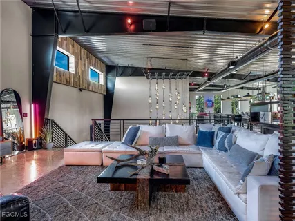 a view of a dining room with furniture and window