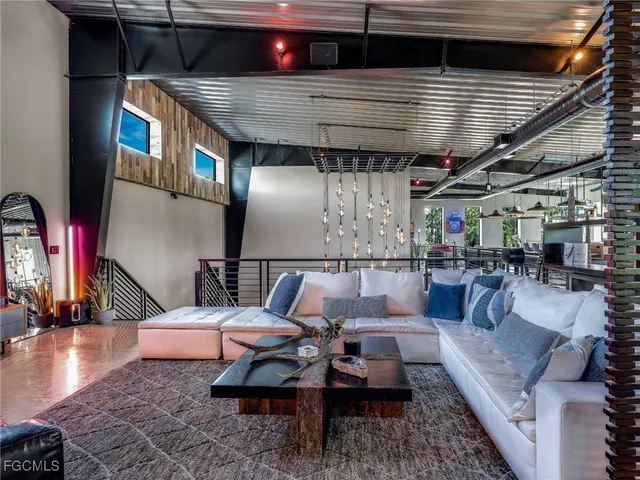 a outdoor living space with patio furniture and a fireplace