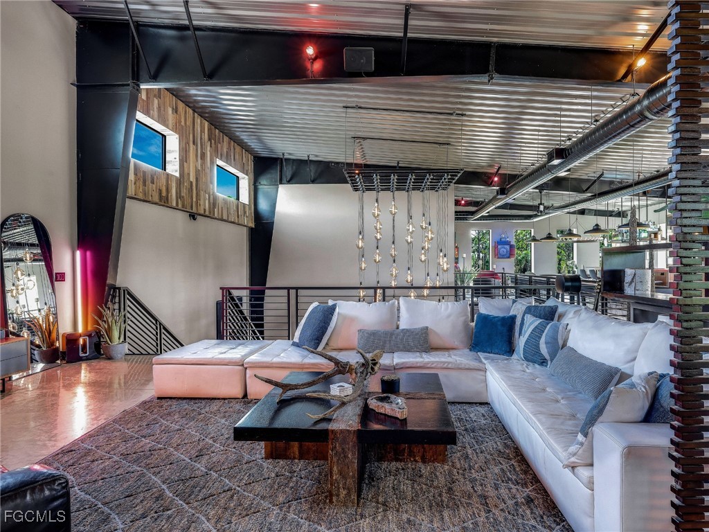 4412 Pinetree Boulevard St. James City, FL 33956 - Photo 17 of 50 a outdoor living space with patio furniture and a fireplace