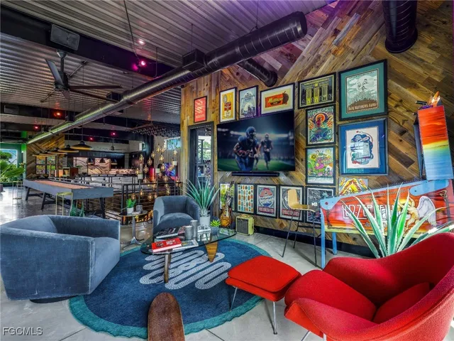 a outdoor living space with furniture and a flat screen tv