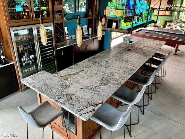 a view of a chairs and table in a patio
