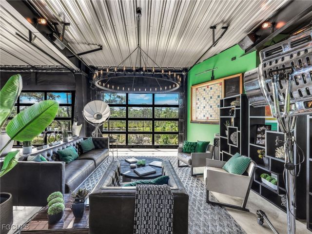 a backyard of a house with plants and outdoor seating