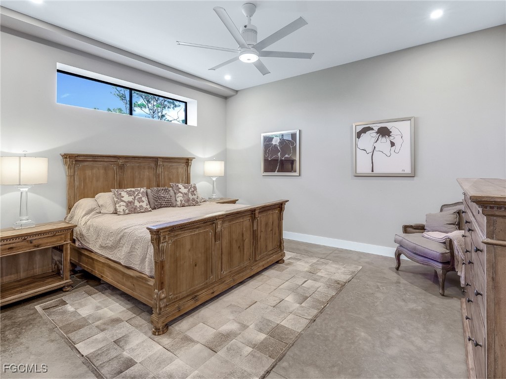 4412 Pinetree Boulevard St. James City, FL 33956 - Photo 29 of 50 a bedroom with a bed and a chandelier