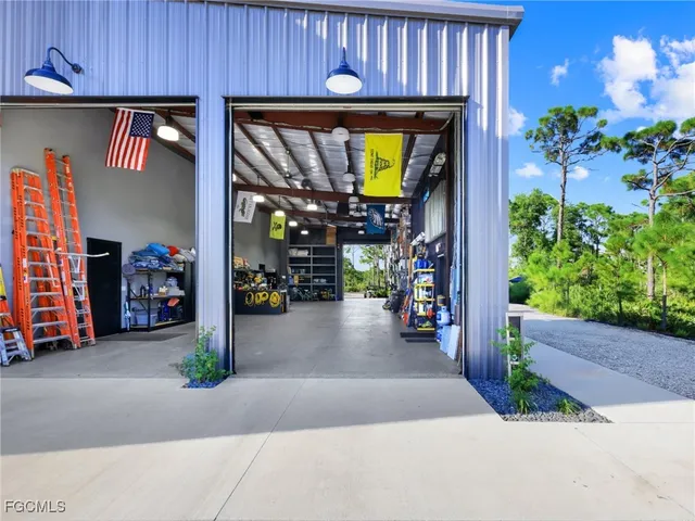 a backyard of a house with plants and outdoor seating