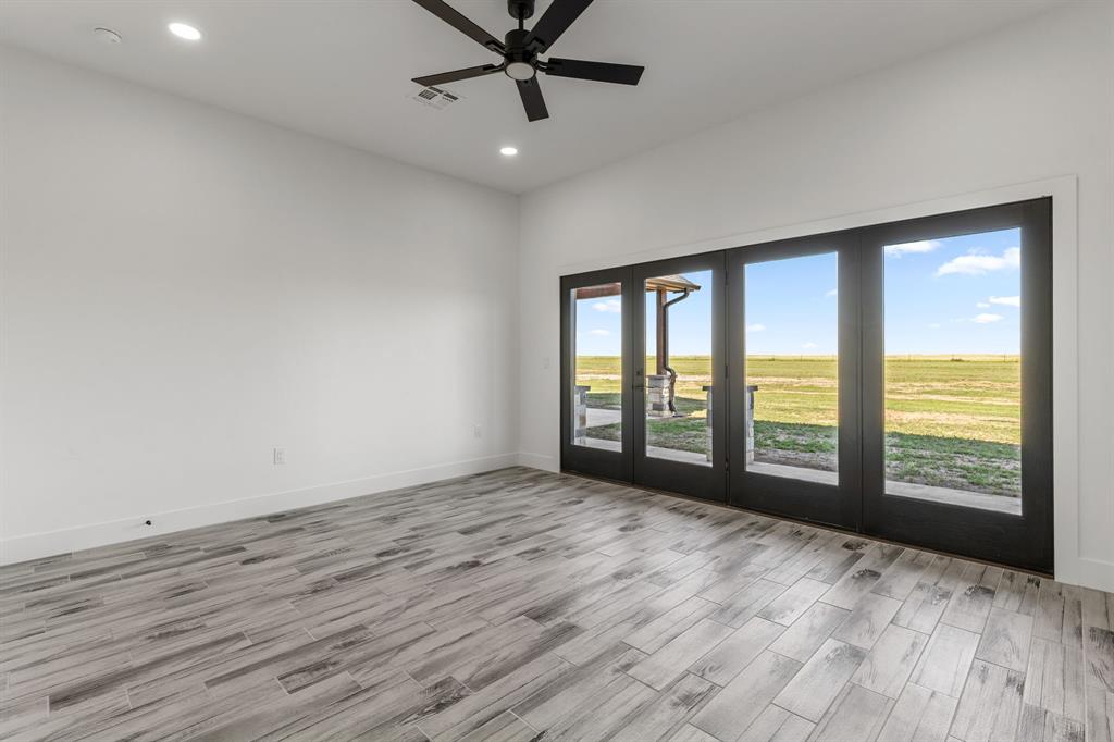 2311 Parker Road Wichita Falls, TX 76310 - Photo 20 of 32 a view of an empty room with a window and wooden floor