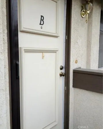 a bathroom with a shower and a door