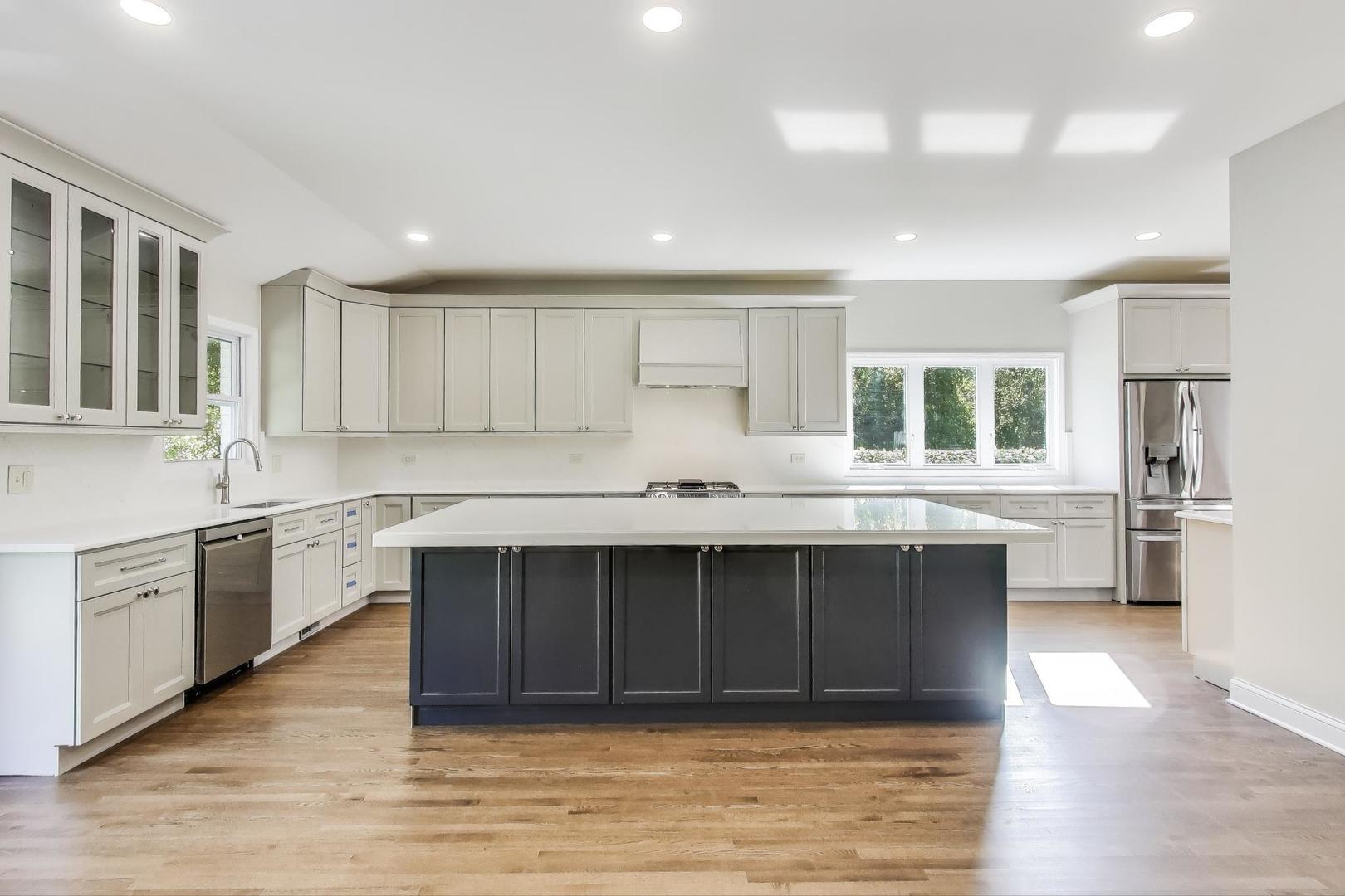 1627 South Ridge Road Lake Forest, IL 60045 - Photo 11 of 30 a kitchen with granite countertop a stove sink and cabinets