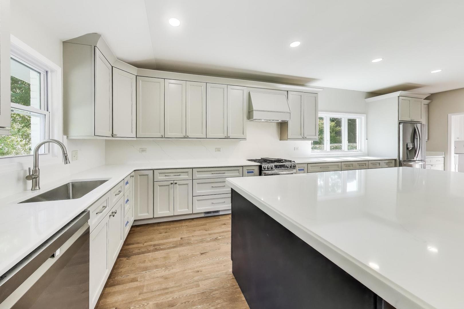 1627 South Ridge Road Lake Forest, IL 60045 - Photo 12 of 30 a kitchen with a sink stove and cabinets