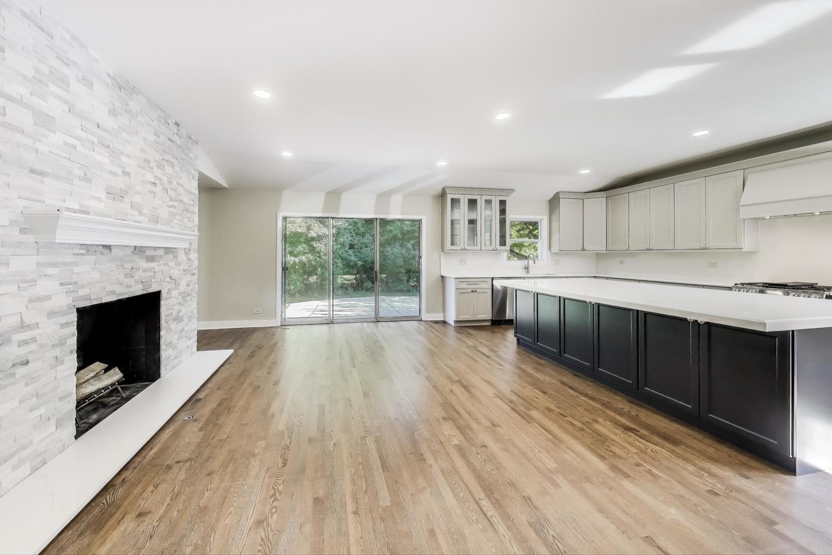 1627 South Ridge Road Lake Forest, IL 60045 - Photo 13 of 30 a large kitchen with a wooden floor and a large window