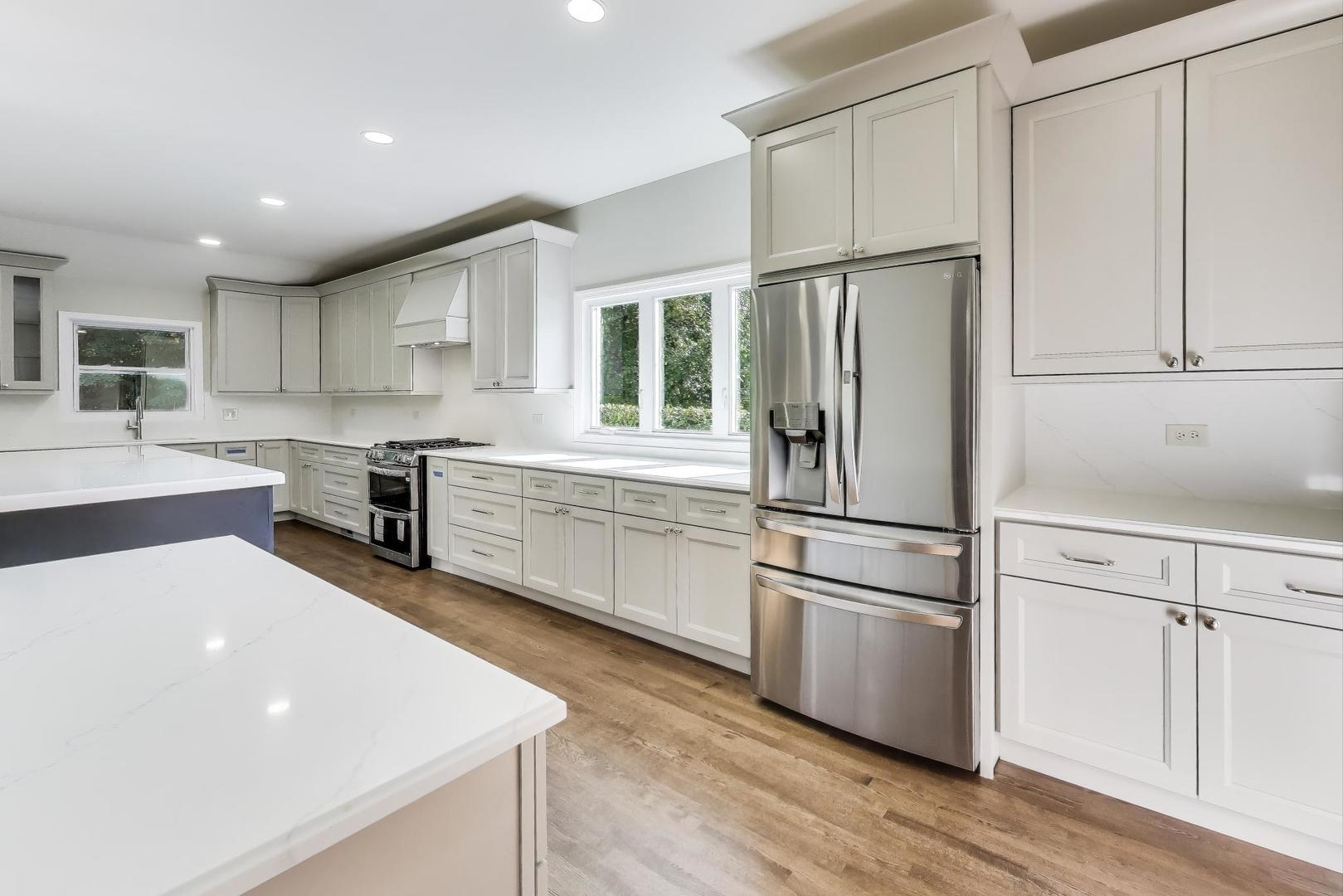 1627 South Ridge Road Lake Forest, IL 60045 - Photo 16 of 30 a kitchen with stainless steel appliances a refrigerator sink and cabinets