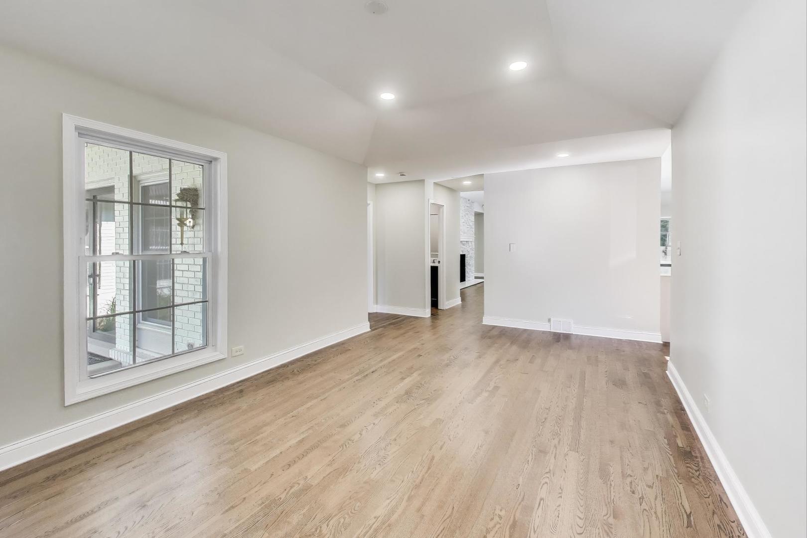 1627 South Ridge Road Lake Forest, IL 60045 - Photo 18 of 30 wooden floor in an empty room with a window