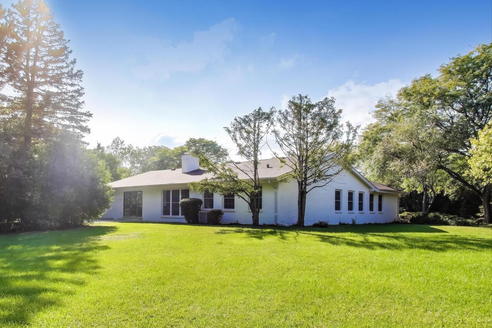 1627 South Ridge Road Lake Forest, IL 60045 - Photo 24 of 30 a front view of house with yard outdoor seating and barbeque oven
