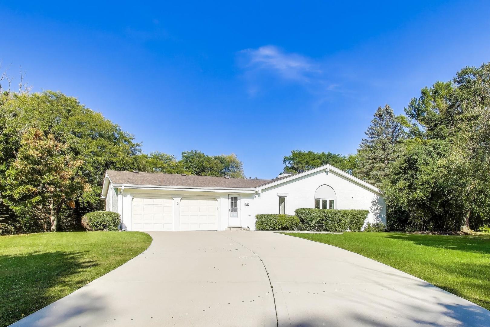 1627 South Ridge Road Lake Forest, IL 60045 - Photo 30 of 30 a view of a white house with a big yard