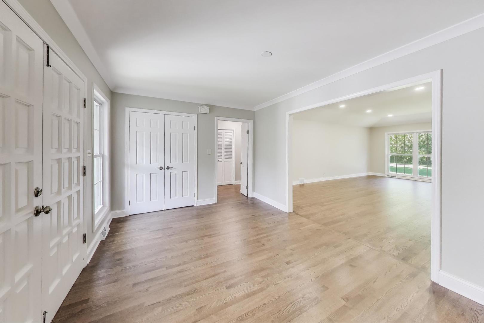 1627 South Ridge Road Lake Forest, IL 60045 - Photo 5 of 30 a view of a hallway with wooden floor