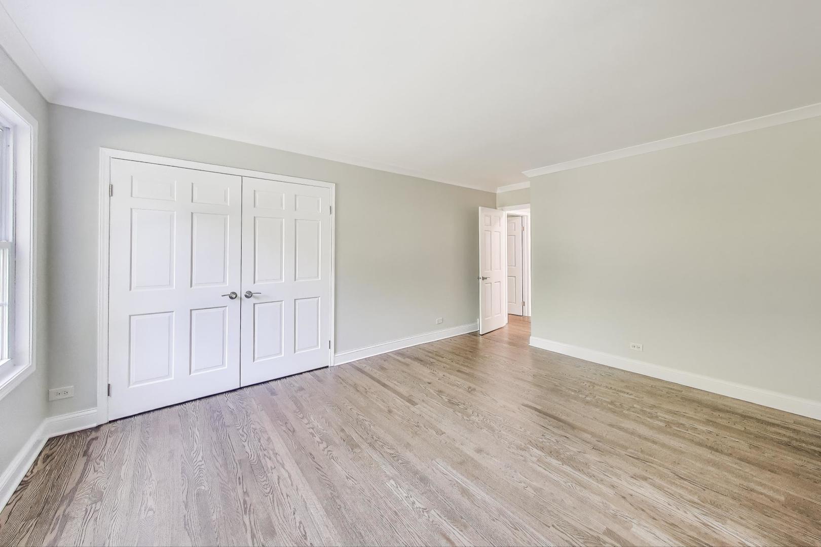1627 South Ridge Road Lake Forest, IL 60045 - Photo 7 of 30 a view of an empty room with wooden floor