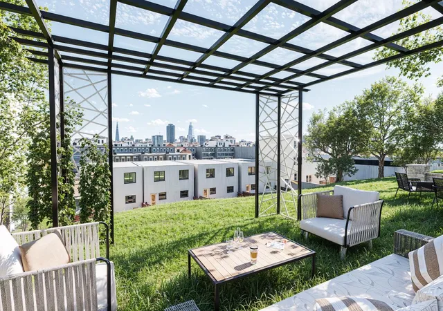 a view of a patio with a table chairs and a couches