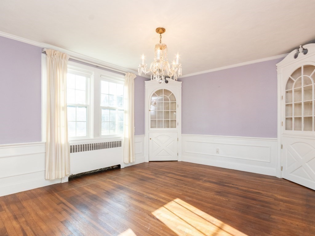 20 Ferncroft Road Boston, MA 02132 - Photo 8 of 40 a view of empty room with wooden floor and fan
