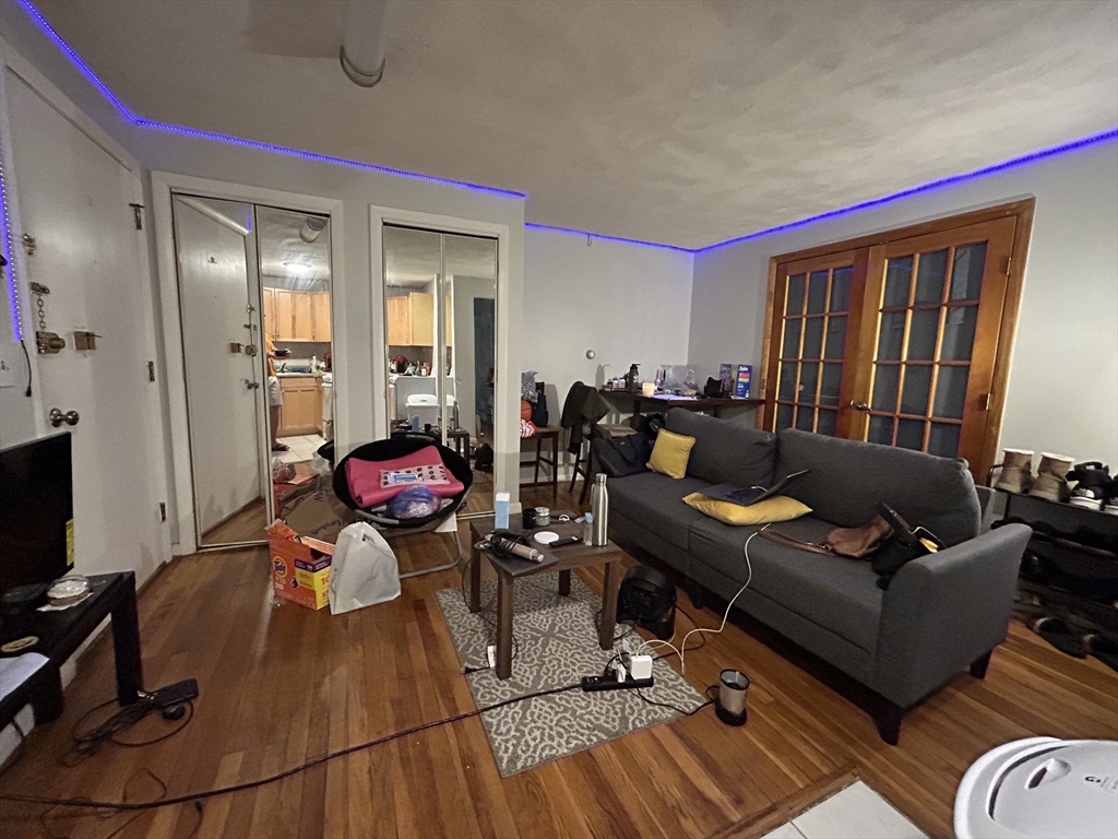 20 Radcliffe Road, Unit 206 Boston, MA 02134 - Photo 4 of 13 a living room with furniture and a flat screen tv
