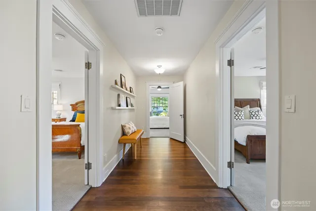 a view of a hallway with seating area