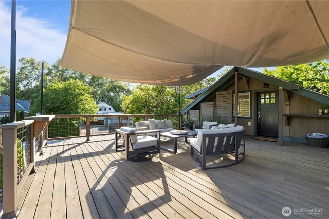 a front view of a house with a yard garage and outdoor seating