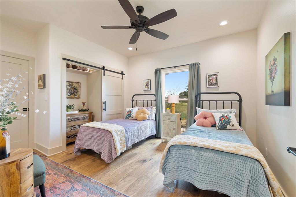 1010 Fm 583 Street West Rising Star, TX 76471 - Photo 30 of 40 a bedroom with two beds and painting on the wall