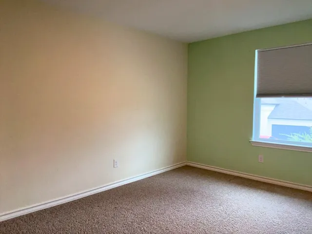 a view of an empty room and stairs