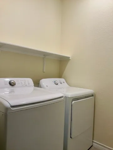 a view of backyard with balcony