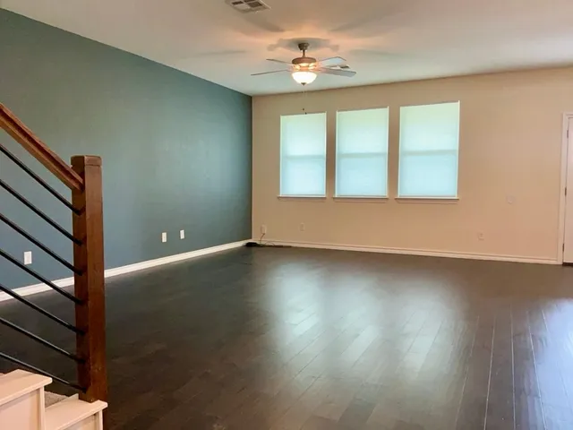 a view of room with window and hardwood floor