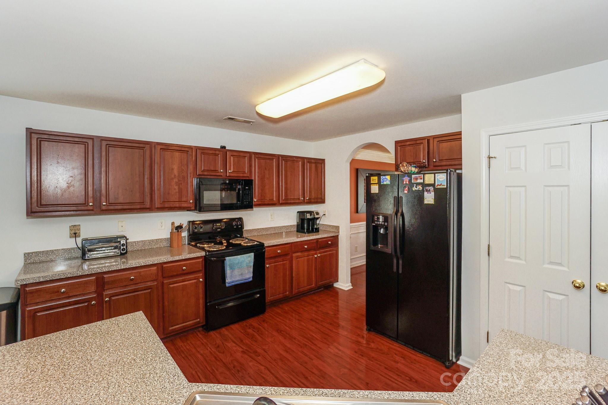 166 Glennallen Road Mooresville, NC 28115 - Photo 13 of 48 a kitchen with a refrigerator stove and sink
