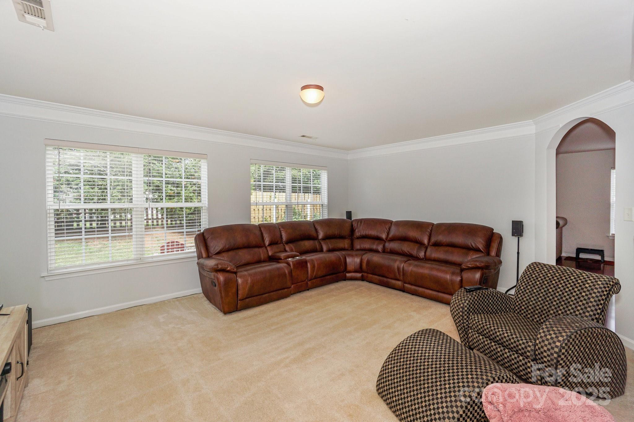 166 Glennallen Road Mooresville, NC 28115 - Photo 20 of 48 a living room with furniture window and a lamp