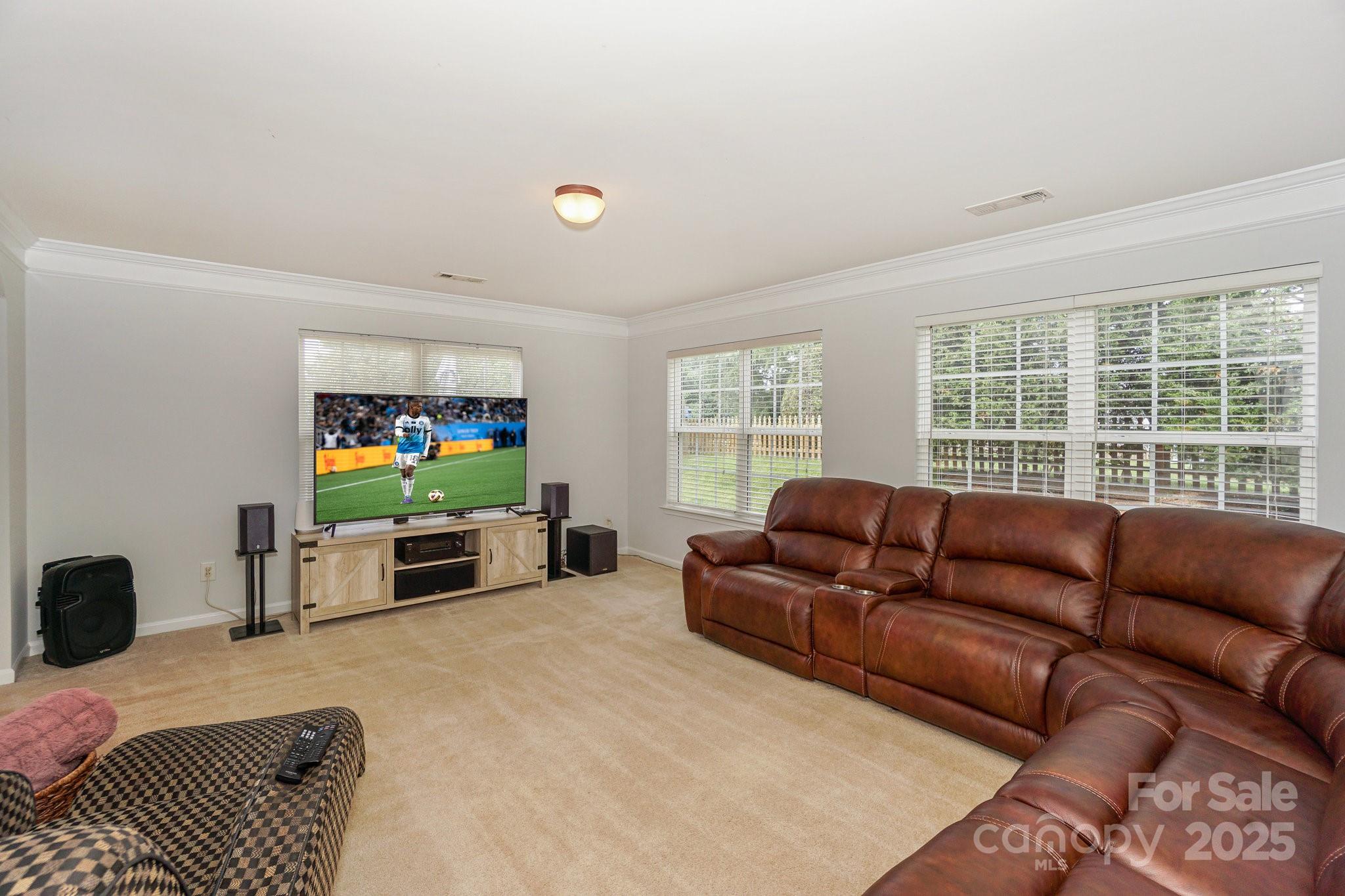 166 Glennallen Road Mooresville, NC 28115 - Photo 21 of 48 a living room with furniture and a flat screen tv