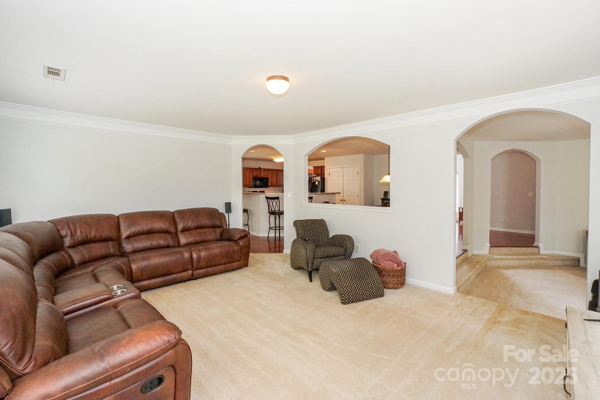 166 Glennallen Road Mooresville, NC 28115 - Photo 22 of 48 a living room with furniture ceiling fan