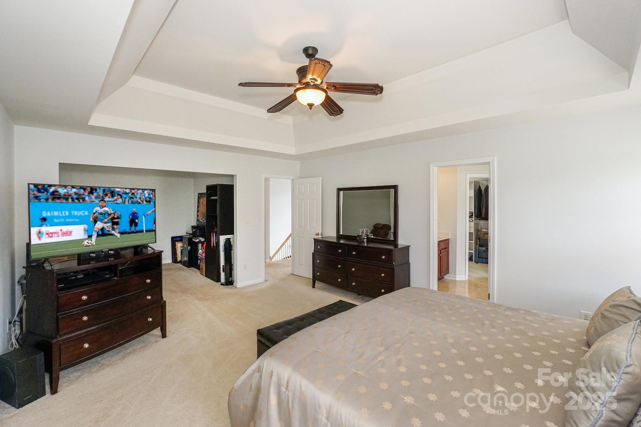 166 Glennallen Road Mooresville, NC 28115 - Photo 27 of 48 a bedroom with a bed and a flat tv screen on dresser