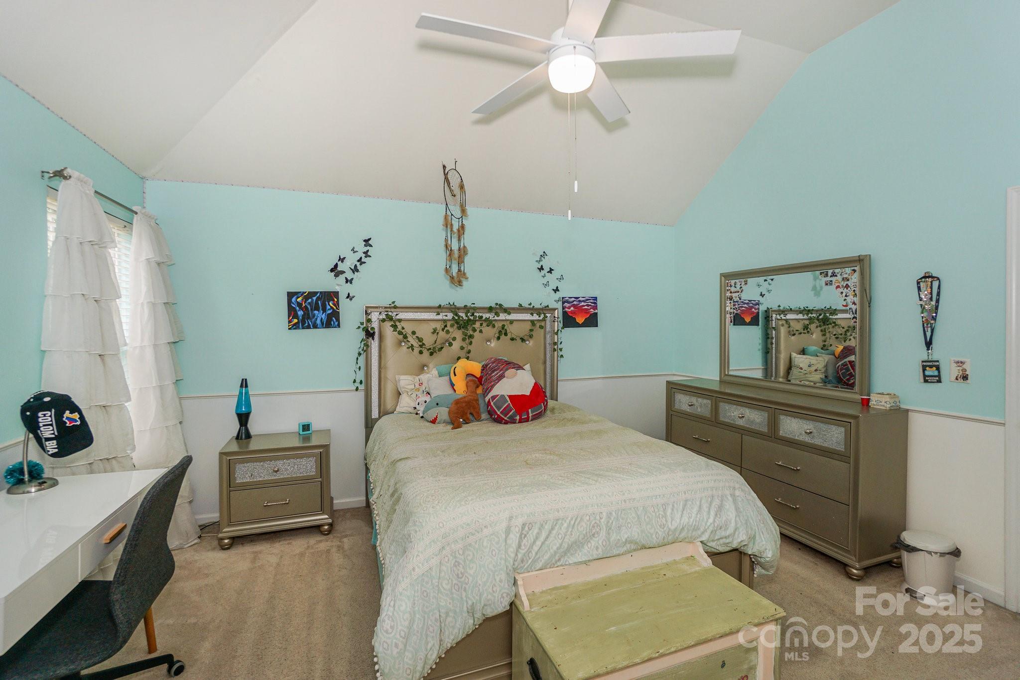166 Glennallen Road Mooresville, NC 28115 - Photo 36 of 48 a bedroom with a bed and a chandelier