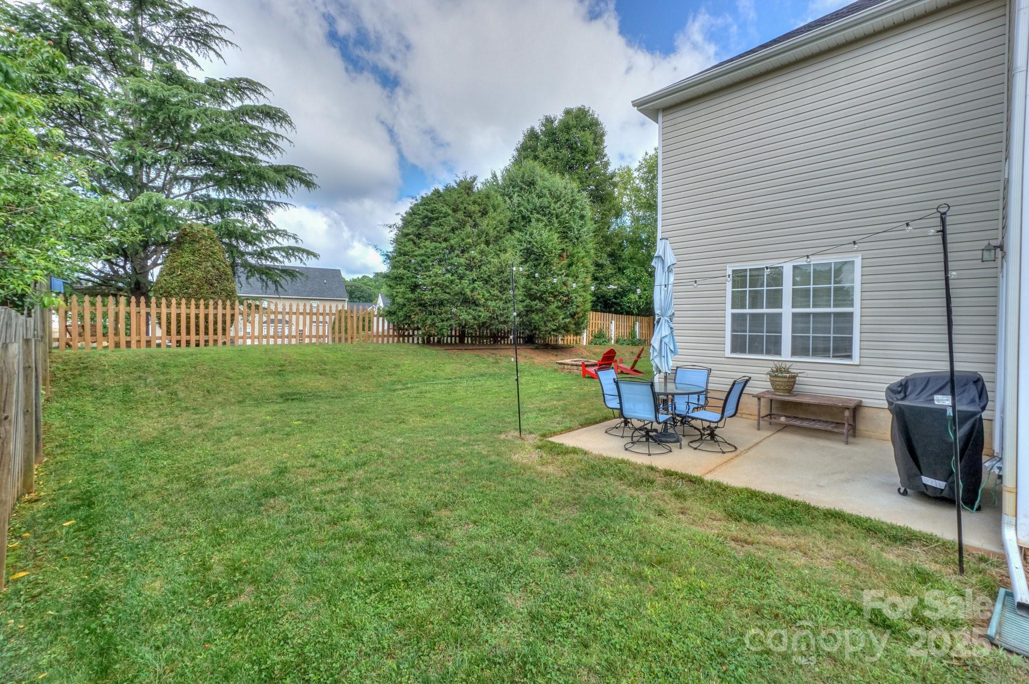 166 Glennallen Road Mooresville, NC 28115 - Photo 44 of 48 a view of a backyard with sitting area and furniture