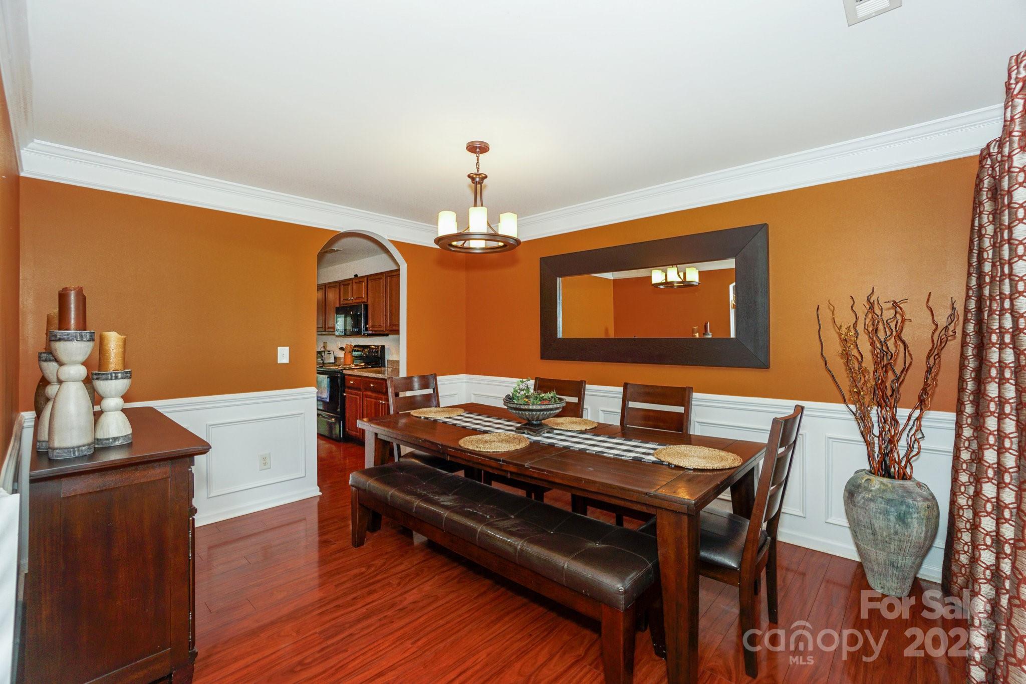 166 Glennallen Road Mooresville, NC 28115 - Photo 6 of 48 a view of a dining room with furniture and wooden floor