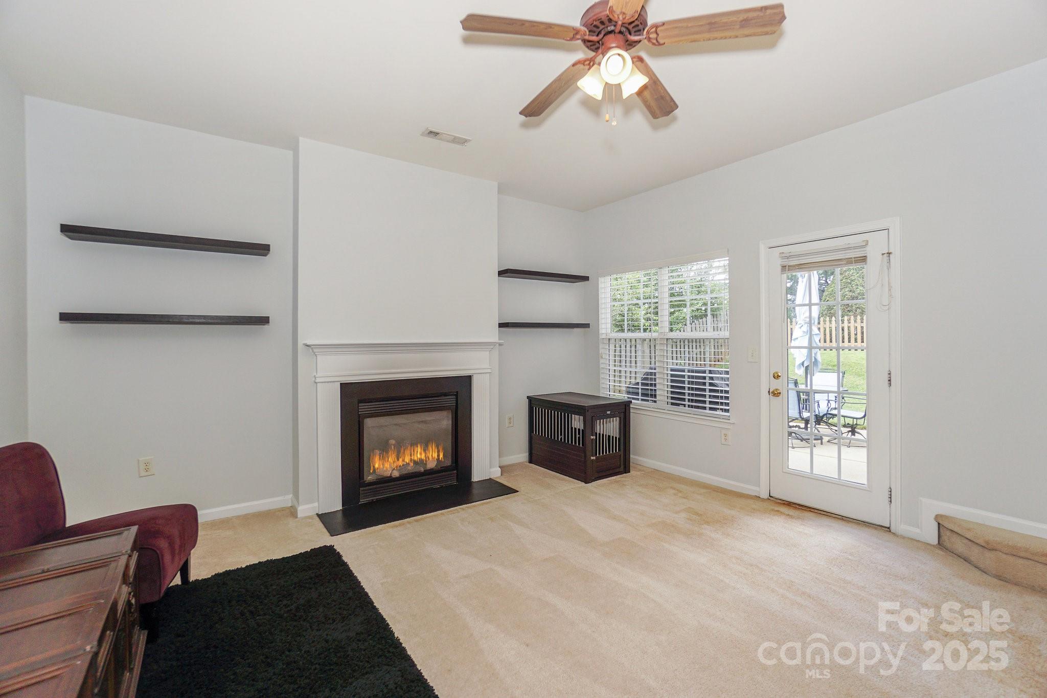 166 Glennallen Road Mooresville, NC 28115 - Photo 9 of 48 a living room with furniture and a fireplace