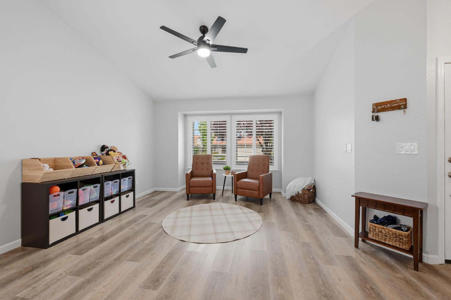 5013 Charter Road Rocklin, CA 95765 - Photo 4 of 35 a living room with furniture a window and a ceiling fan