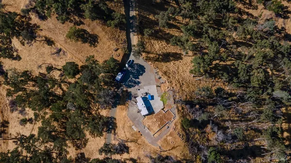 an aerial view of a house with a garden