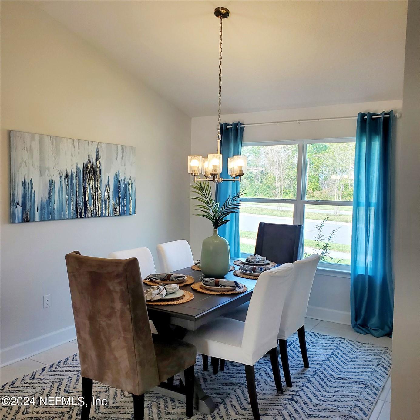 70 Rivertown Road Palm Coast, FL 32137 - Photo 13 of 25 a view of a dining room with furniture window and outside view