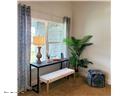 70 Rivertown Road Palm Coast, FL 32137 - Photo 17 of 25 a view of a hallway with furniture and a potted plant