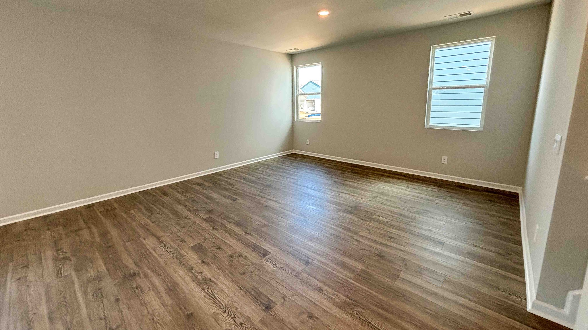 301 Harvest Point Boulevard Spring Hill, TN 37174 - Photo 12 of 25 an empty room with wooden floor and windows